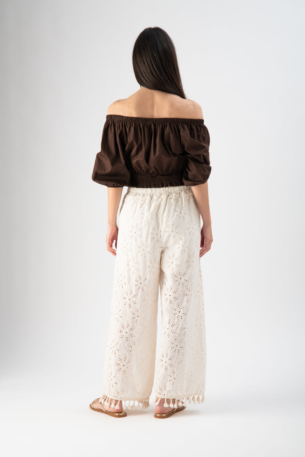 Pantalone in sangallo con nappine sul fondo